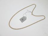 a close up of a gold chain with a tag on it
