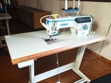 an image of a sewing machine sitting on a table