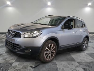 the silver nissan suv is parked on a checkered tile floor