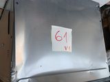 a metal box with a sticker on it sitting on a dolly