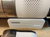 a vacuum and a bag on a table next to each other