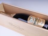 a wooden box with a bottle of wine inside of it