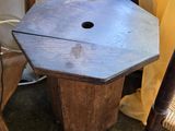 a wooden table with a hole in the middle of it