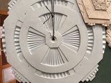 a large clock that is on the wall in the room