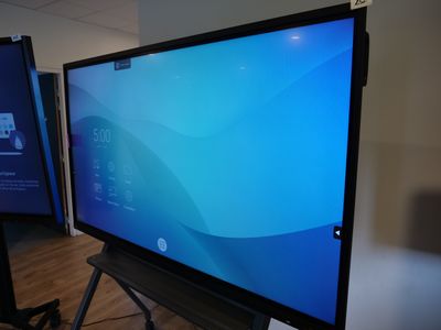 a flat screen tv sitting on a stand in a room