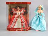 doll in a box with a barbie doll in it and a barbie doll in a blue dress