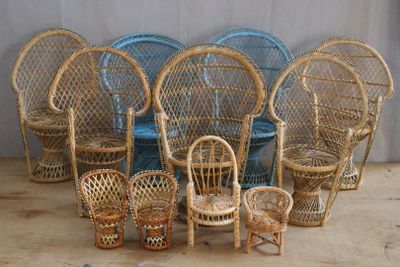 many wicker chairs and chairs arranged in a circle