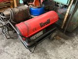a red fire extinguisor sitting on a cart in a garage