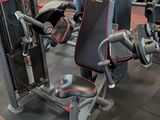 a gym with a lot of machines in the room