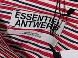 a close up of a striped shirt with a tag on it