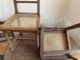 two chairs and a table in a room with peeling paint