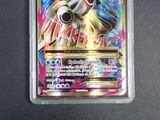 a close up of a pokemon card in a plastic case