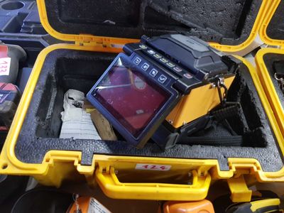 a yellow case with a monitor inside of it