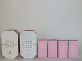 three boxes of soap sitting next to each other on a table