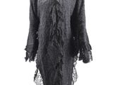 a black dress on a mannequin stand with a white background