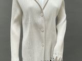 an image of a mannequin wearing a white sweater and black leggings
