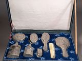 a blue case with silver items inside of it