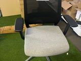 a chair that is sitting in the middle of a room