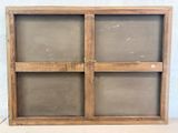 a picture of an old wooden window with four panes