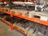 a rack with many different tools on it in a warehouse