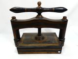 an old fashioned wooden and metal device on a white background