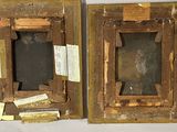 two old picture frames that are on a table