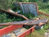 a pile of junk sitting on the side of the road