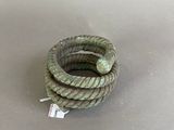 a coil of rope on a table with a tag on it