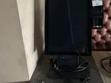 a computer monitor sitting on top of a desk