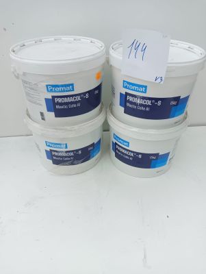 three buckets of paint sitting on top of a white table