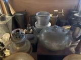 a table with a lot of old metal items on it