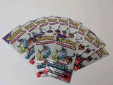 a bunch of pokemon cards sitting on top of a table