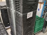 many crates stacked on top of each other in a warehouse