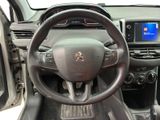 the interior of a car with a steering wheel and dashboard controls