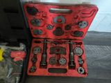 a red case with tools in it sitting on the floor