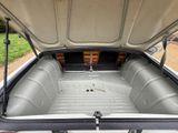 a trunk of a car with the back seats folded down