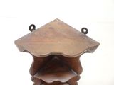 a small wooden table with a shelf on top of it