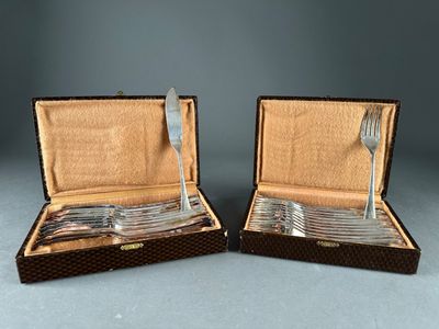 pair of silver plated forks and spoons in a case