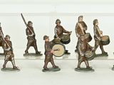many figurines of men with drums and drums