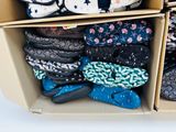 many pairs of slippers that are in a box