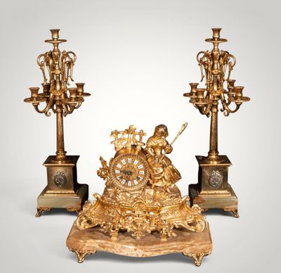pair of antique bronze candlesticks with cherensils and figurines