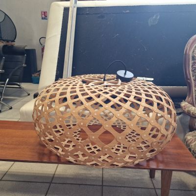 two chairs and a table with a lamp on top of it