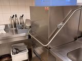 a stainless steel kitchen with a sink and a counter