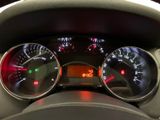 a close up of a car dashboard with various gauges