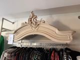 an image of a clothing rack with clothes on it