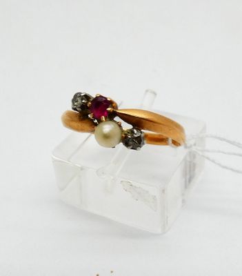 an image of a gold ring with a pearl and garnett