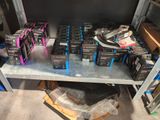 many boxes of electronics on a shelf in a room