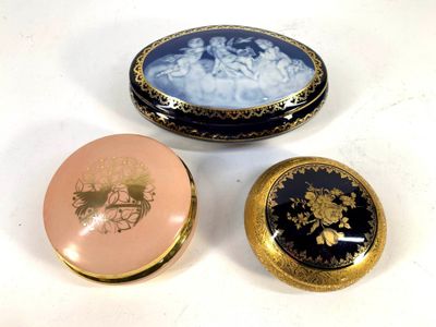 three different types of decorative boxes sitting on a white surface