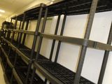 a long shelf with lots of boxes on it