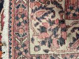 an image of a close up of a rug with a cat laying on top of it